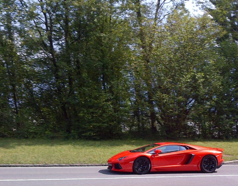 Red sports car on a road