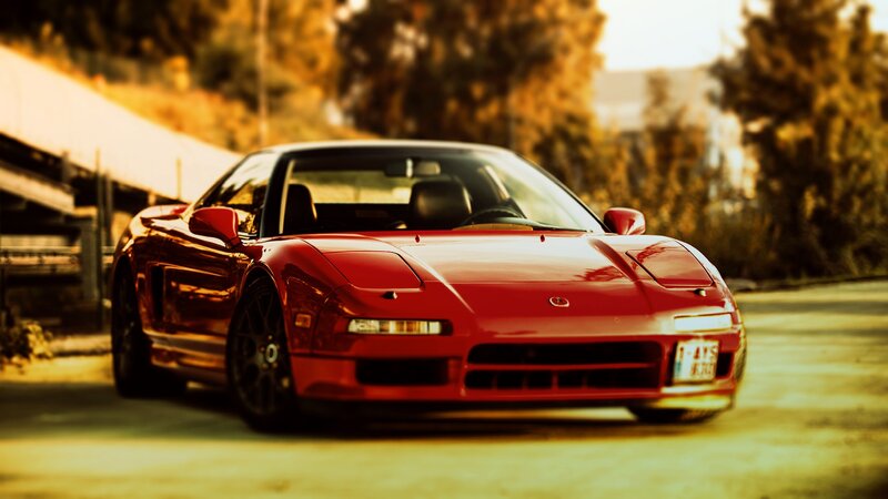 Red sports car on a road