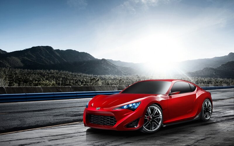 Red sports car on a road
