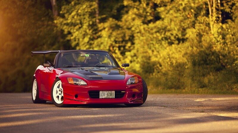 Red sports car on a road