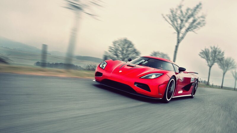 red sports car on a road