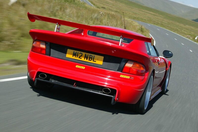 Red sports car on a road
