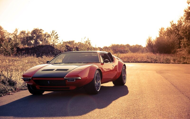 Red sports car on a road