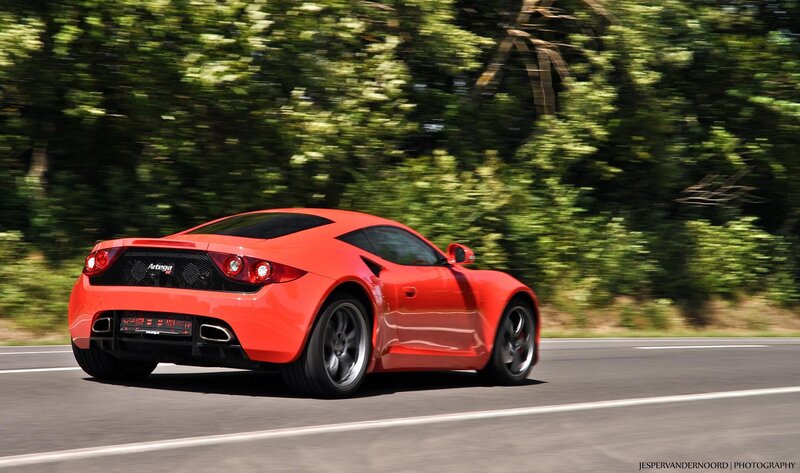 Red sports car on a road