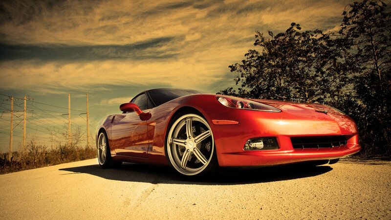 Red sports car on a road