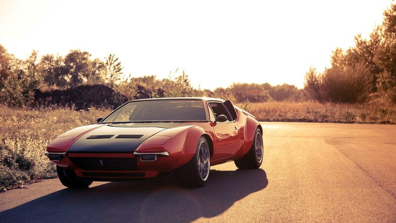 Red sports car on a road