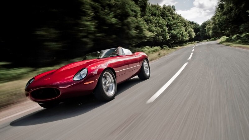 Red sports car on a road