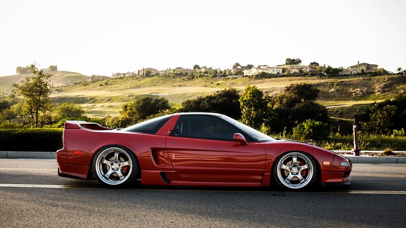 red sports car on a road