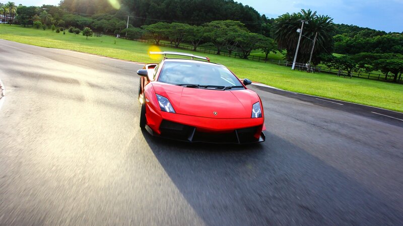 red sports car on a road