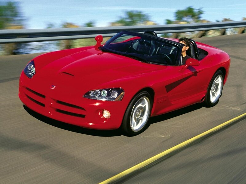 Red sports car on a road