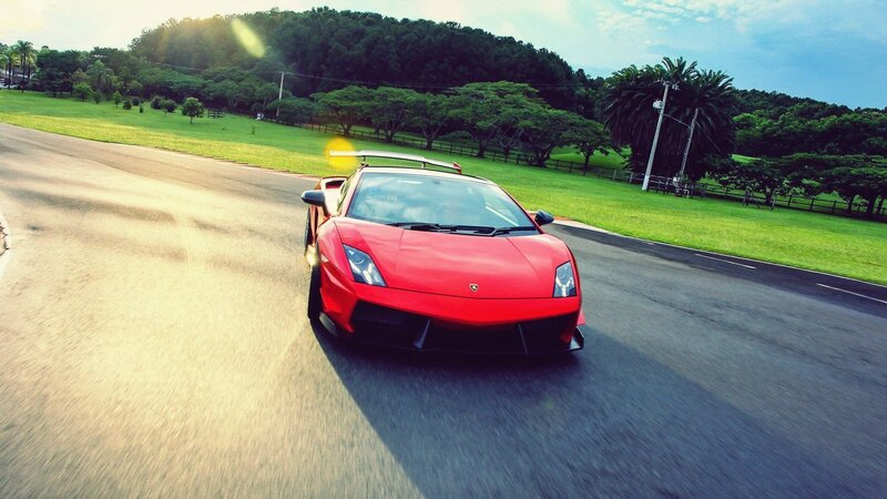 red sports car on a road