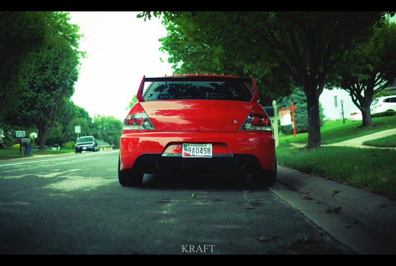 red sports car on a street