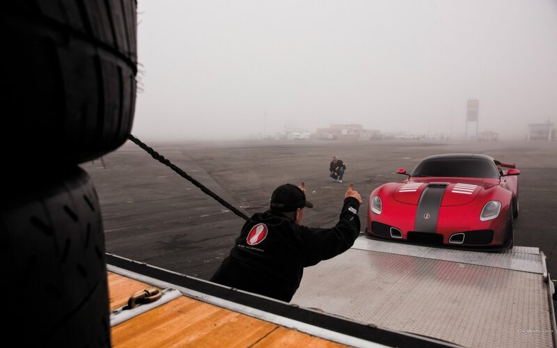 Red sports car on a trailer