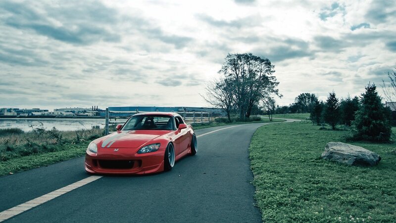 Red sports car on a winding road