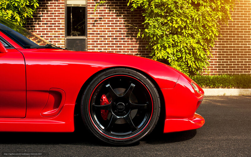 Red sports car on asphalt