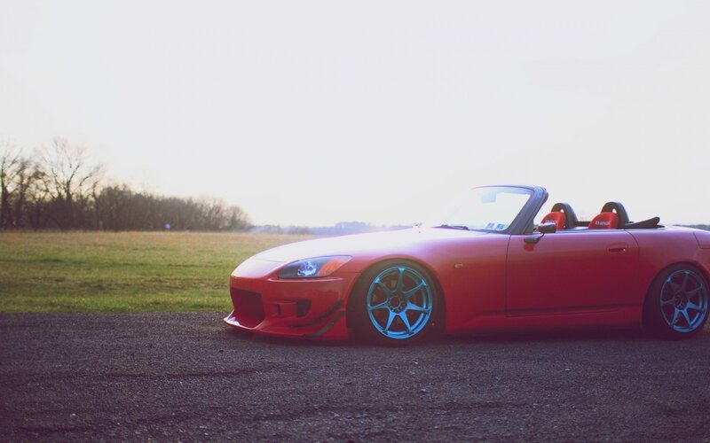 red sports car on asphalt