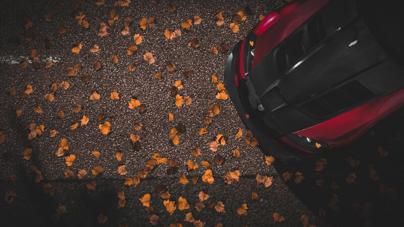 Red Sports Car on Asphalt — Dramatic