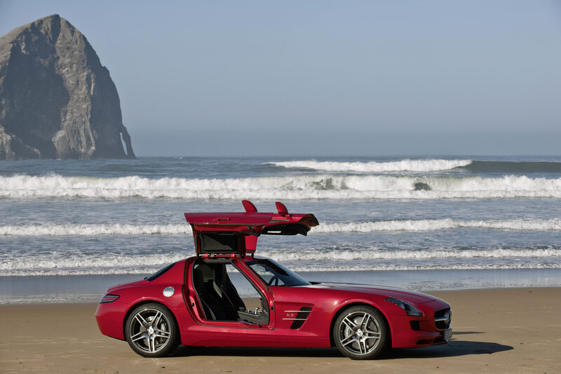 Red sports car on beach
