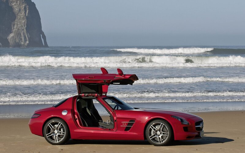 Red sports car on beach
