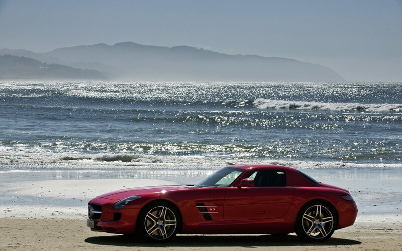 Red sports car on beach