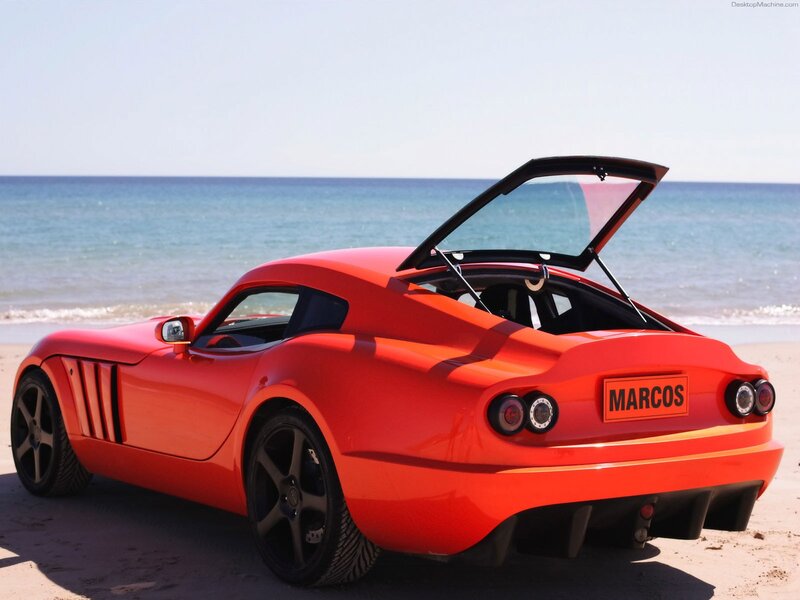 Red sports car on beach