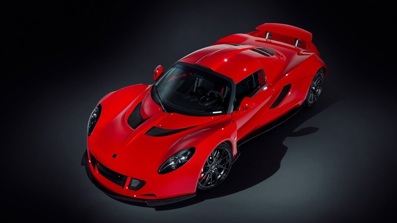red sports car on black background