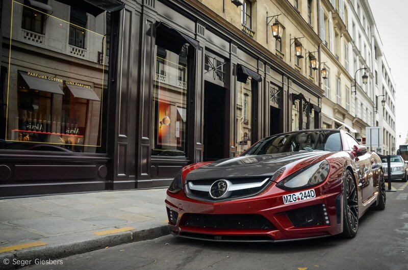 Red sports car on city street