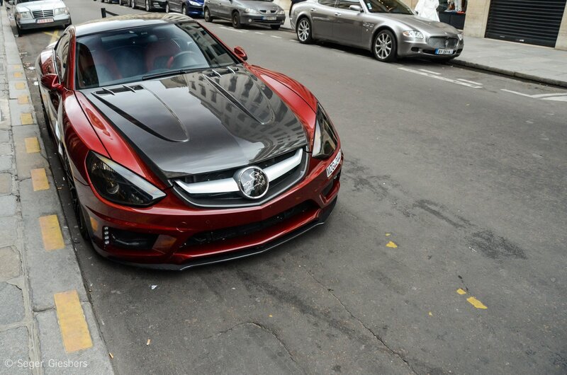 Red sports car on city street
