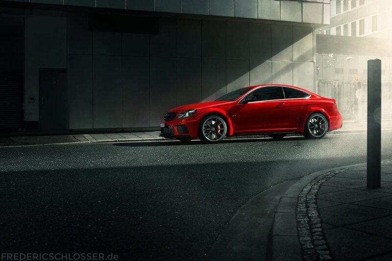 Red sports car on city street