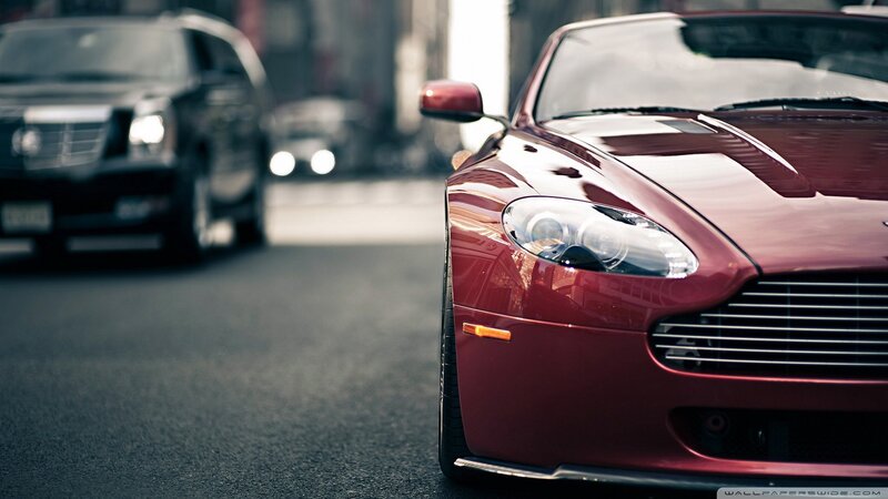 Red sports car on city street