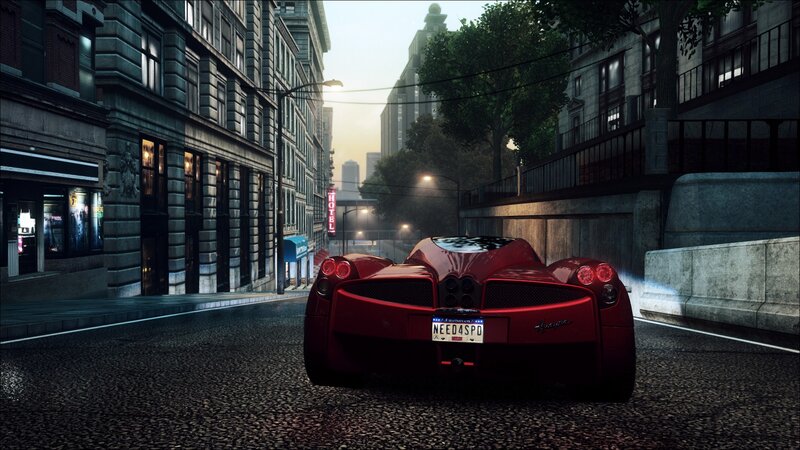 red sports car on city street