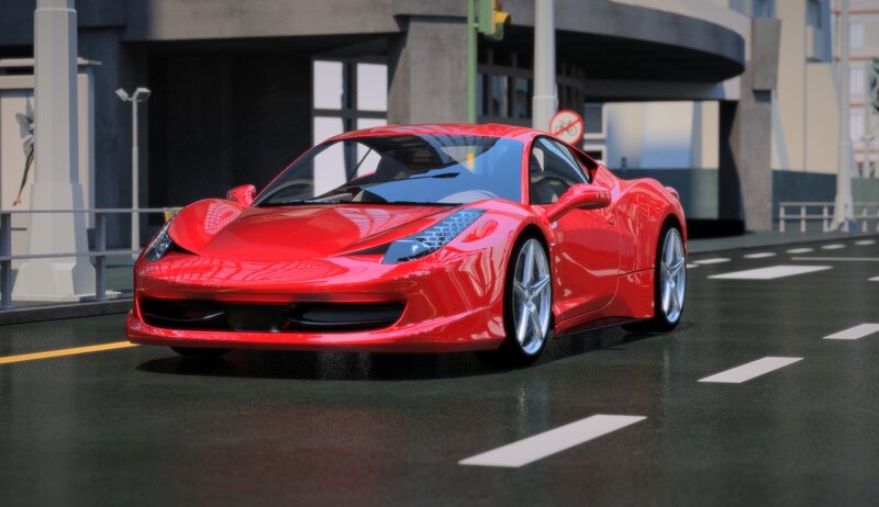 red sports car on city street