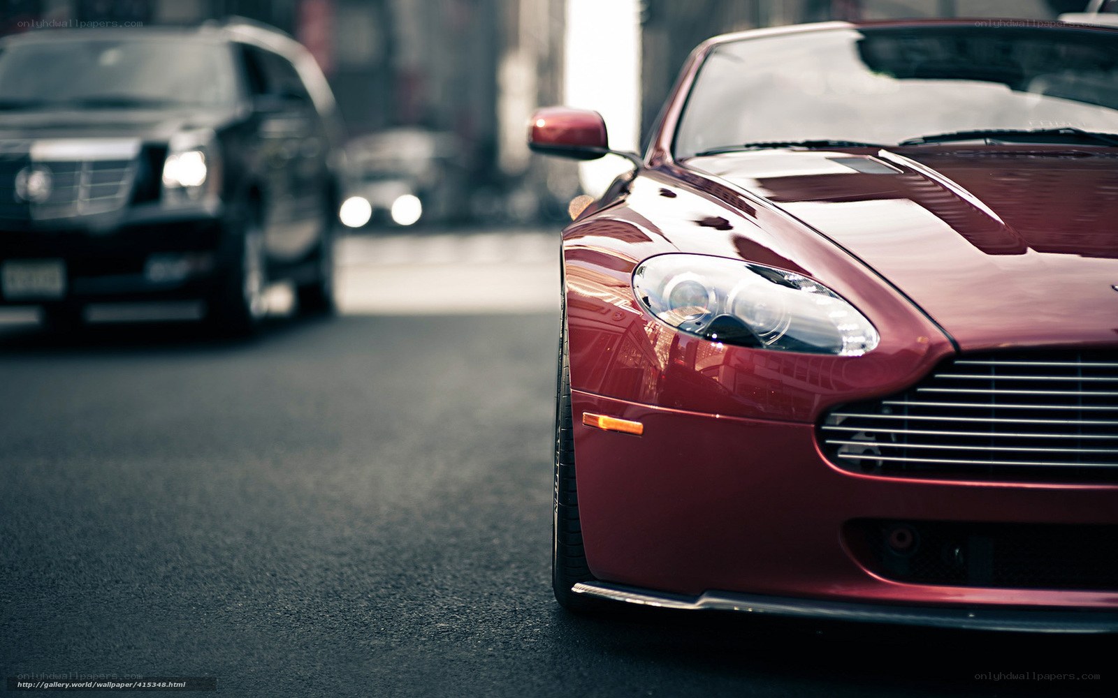 Red sports car on city street