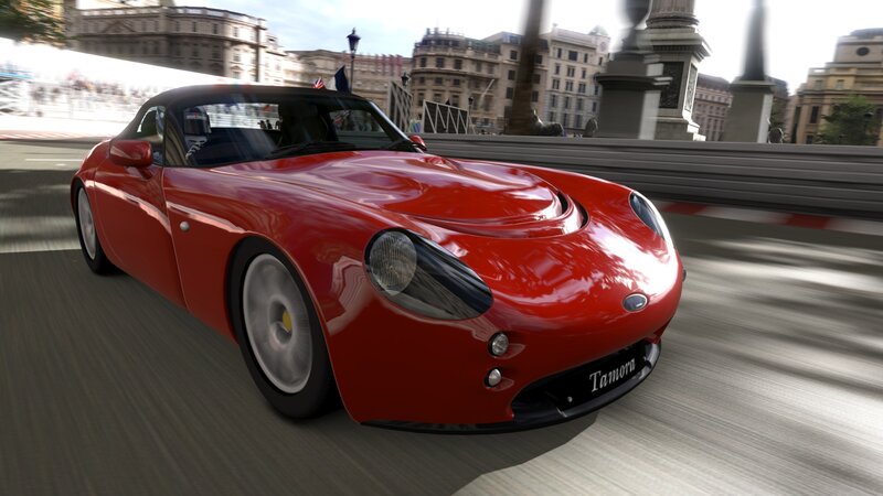 Red sports car on city street