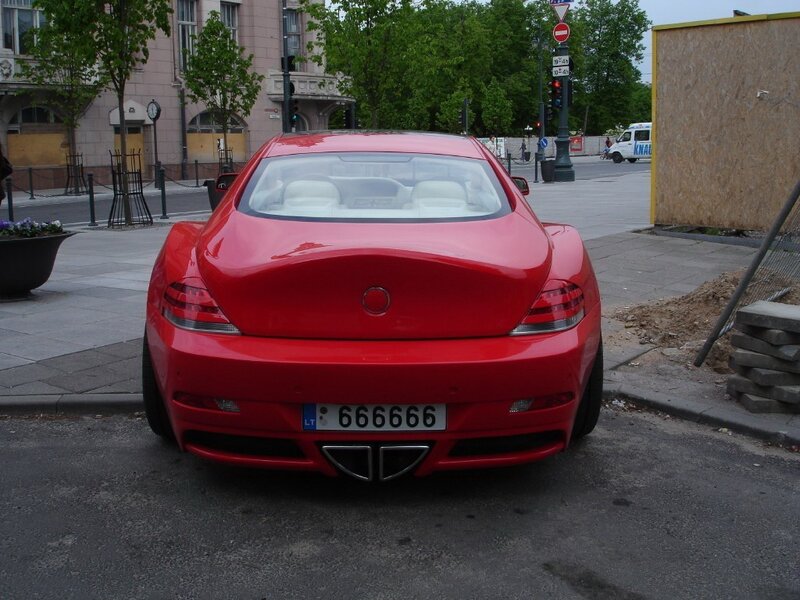 Red sports car on city street