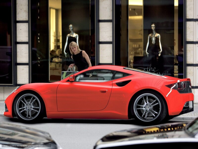 Red sports car on city street