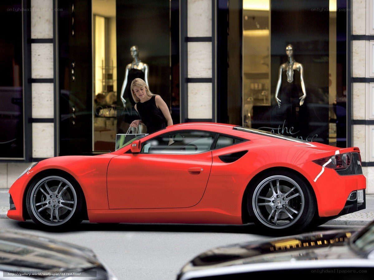 Red sports car on city street