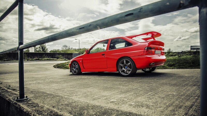 red sports car on concrete