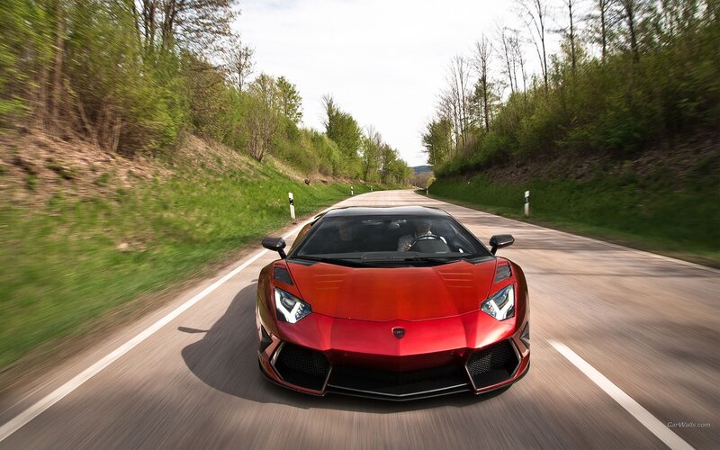 red sports car on country road