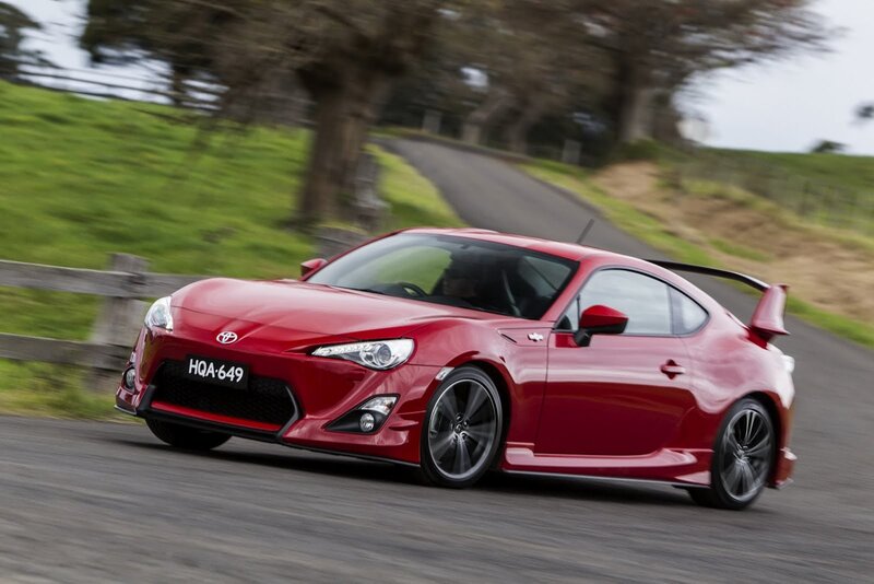 Red sports car on country road