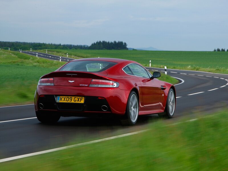 red sports car on country road