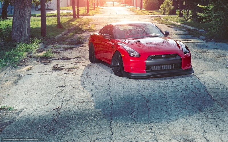 Red sports car on cracked road