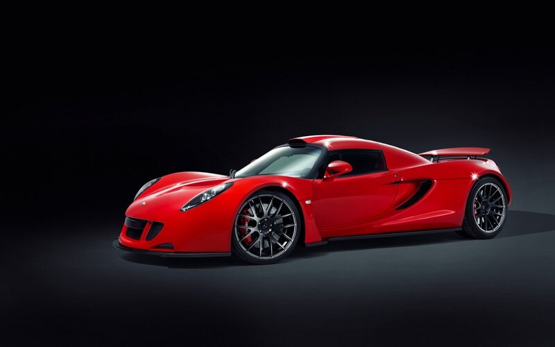 Red sports car on dark background