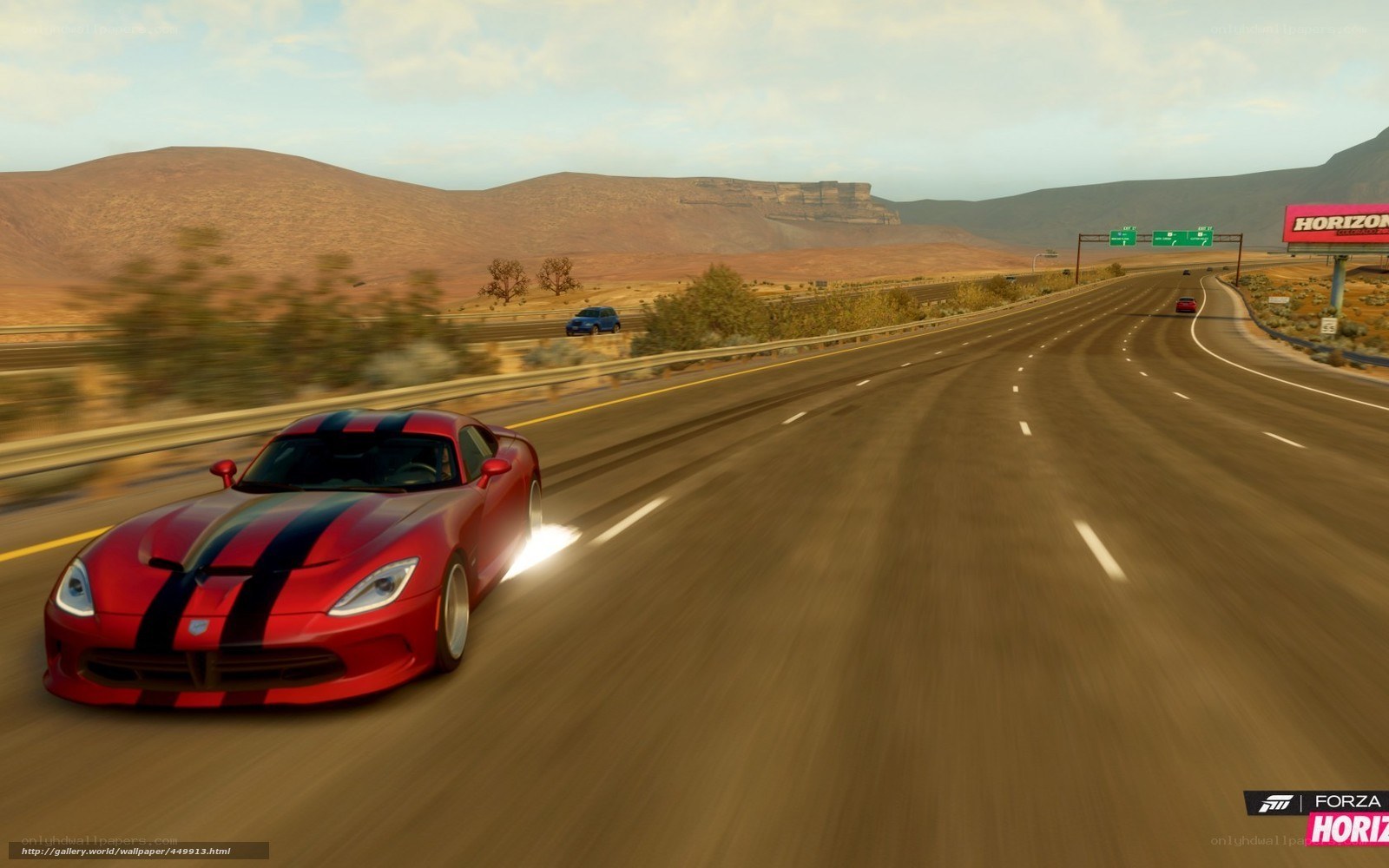 Red sports car on desert highway