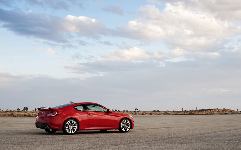 Red sports car on desert road