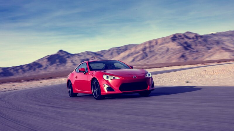 red sports car on desert road
