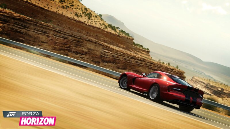 Red sports car on desert road