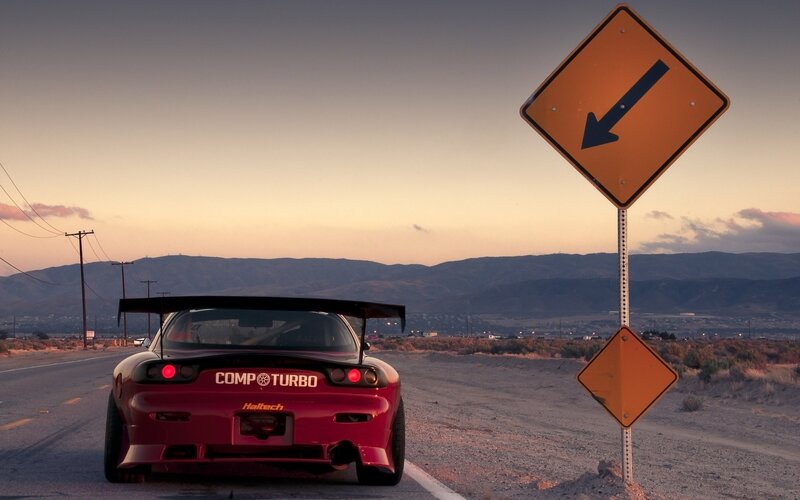 red sports car on desert road