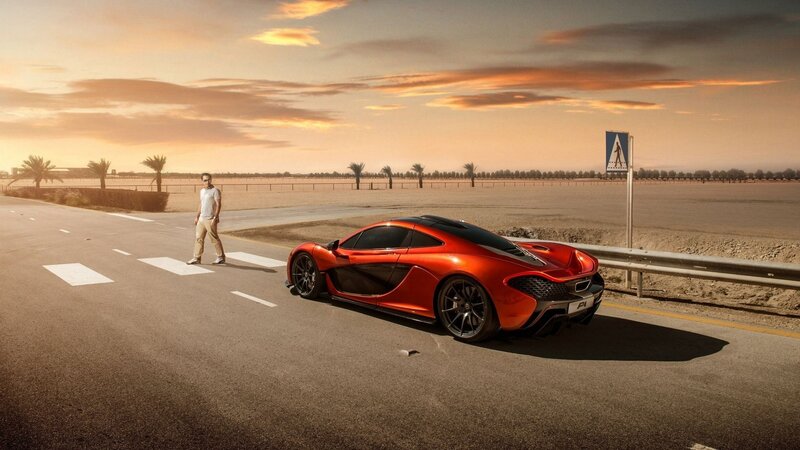 Red sports car on desert road