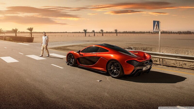 Red sports car on desert road